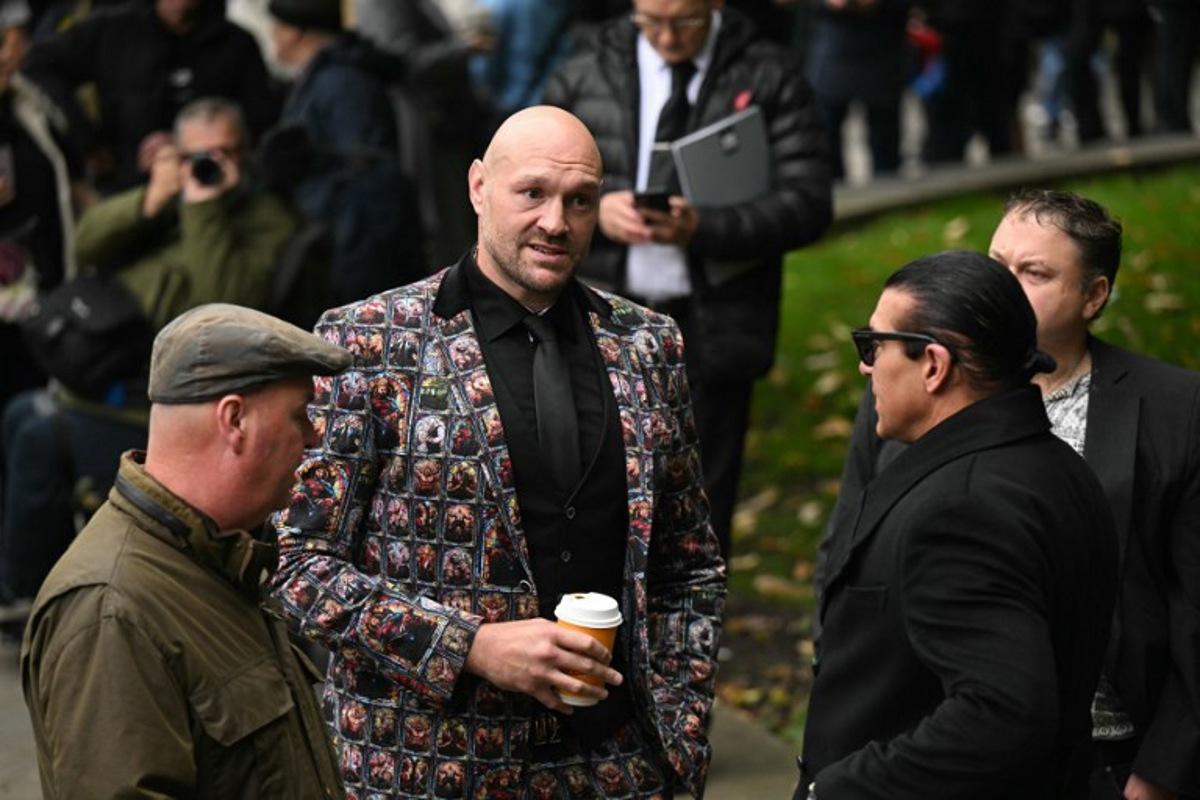 British boxer Tyson Fury arrives to attend the funeral of late British boxer Ricky Hatton at Manchester Cathedral, north-west England on October 10, 2025. Ricky Hatton's family said Monday they feel an "immeasurable" sense of loss after the death of the British former boxing world champion at the age of 46. Hatton was found dead at his home in Hyde, Greater Manchester. Oli SCARFF / AFP
