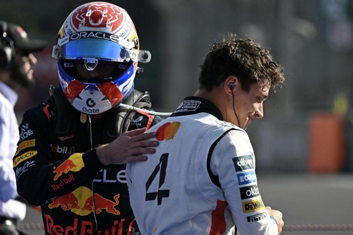 McLaren's British driver Lando Norris (R) celebrates winning with the third-placed Red Bull Racing's Dutch driver Max Verstappen (L) after the Mexico City Formula One Grand Prix at the Hermanos Rodriguez racetrack in Mexico City on October 26, 2025. Yuri CORTEZ / AFP