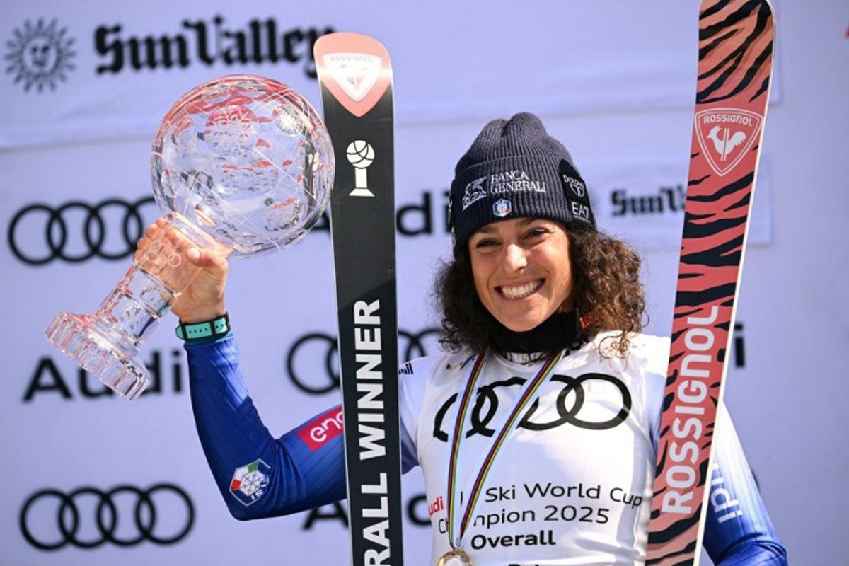 Women's overall winner Federica Brignone celebrates with the crystal globe on the podium at the 2025 FIS Alpine World Cup Finals at Sun Valley Resort in Sun Valley, Idaho, on March 27, 2025. Patrick T. Fallon / AFP