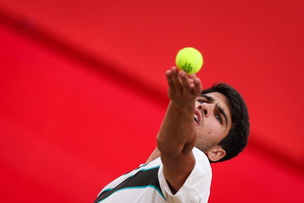 Spain's Carlos Alcaraz serves to Czech Republic's Jiri Lehecka during their men's singles final tennis match at the HSBC ATP tennis Championships at Queen's Club in west London on June 22, 2025. Adrian Dennis / AFP