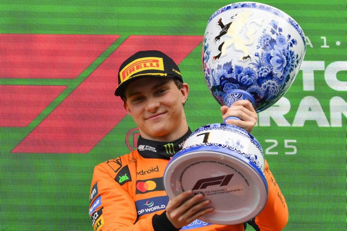 Winner McLaren's Australian driver Oscar Piastri celebrates on the podium following the Formula One Dutch Grand Prix at The Circuit Zandvoort, western Netherlands, on August 31, 2025. JOHN THYS / AFP