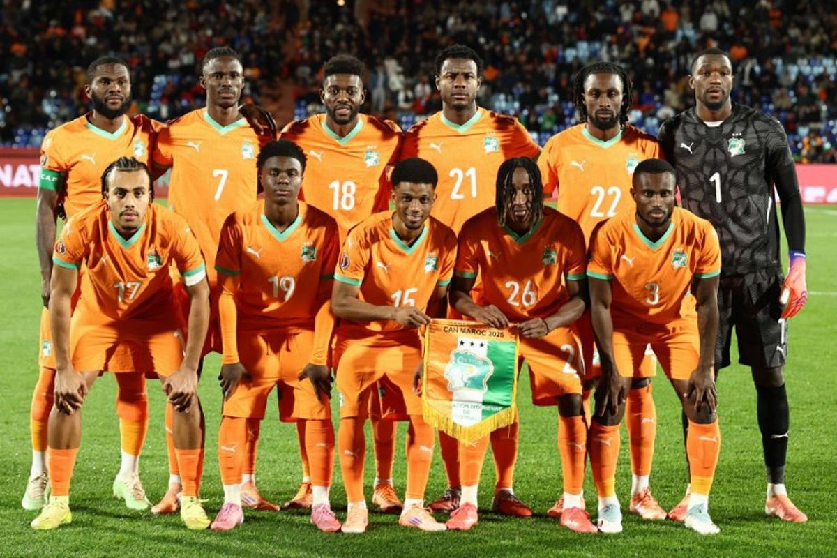 Ivory Coast's midfielder #08 Franck Kessie, Ivory Coast's defender #07 Odilon Kossounou, Ivory Coast's midfielder #18 Ibrahim Sangare, Ivory Coast's defender #21 Evan Ndicka, Ivory Coast's forward #22 Evann Guessand, Ivory Coast's goalkeeper #01 Yahia Fofana and Ivory Coast's defender #17 Guela Doue, Ivory Coast's midfielder #19 Christ Inao Oulai, Ivory Coast's forward #15 Amad Diallo, Ivory Coast's forward #26 Yan Diomande and Ivory Coast's defender #03 Ghislain Konan line up before the Africa Cup of Nations (CAN) round of 16 football match between Ivory Coast and Burkina Faso at the Grand Stadium in Marrakesh on January 6, 2026. Franck FIFE / AFP
