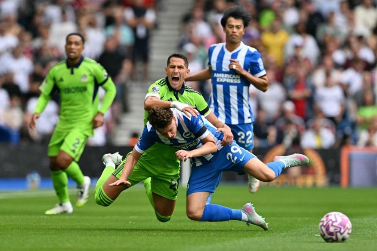 Brighton's Belgian defender #29 Maxim De Cuyper (R) and Fulham's Serbian midfielder #20 Sasa Lukic (L) go down challenging for the ball during the English Premier League football match between Brighton and Hove Albion and Fulham at the American Express Community Stadium in Brighton, southern England on August 16, 2025. Glyn KIRK / AFP