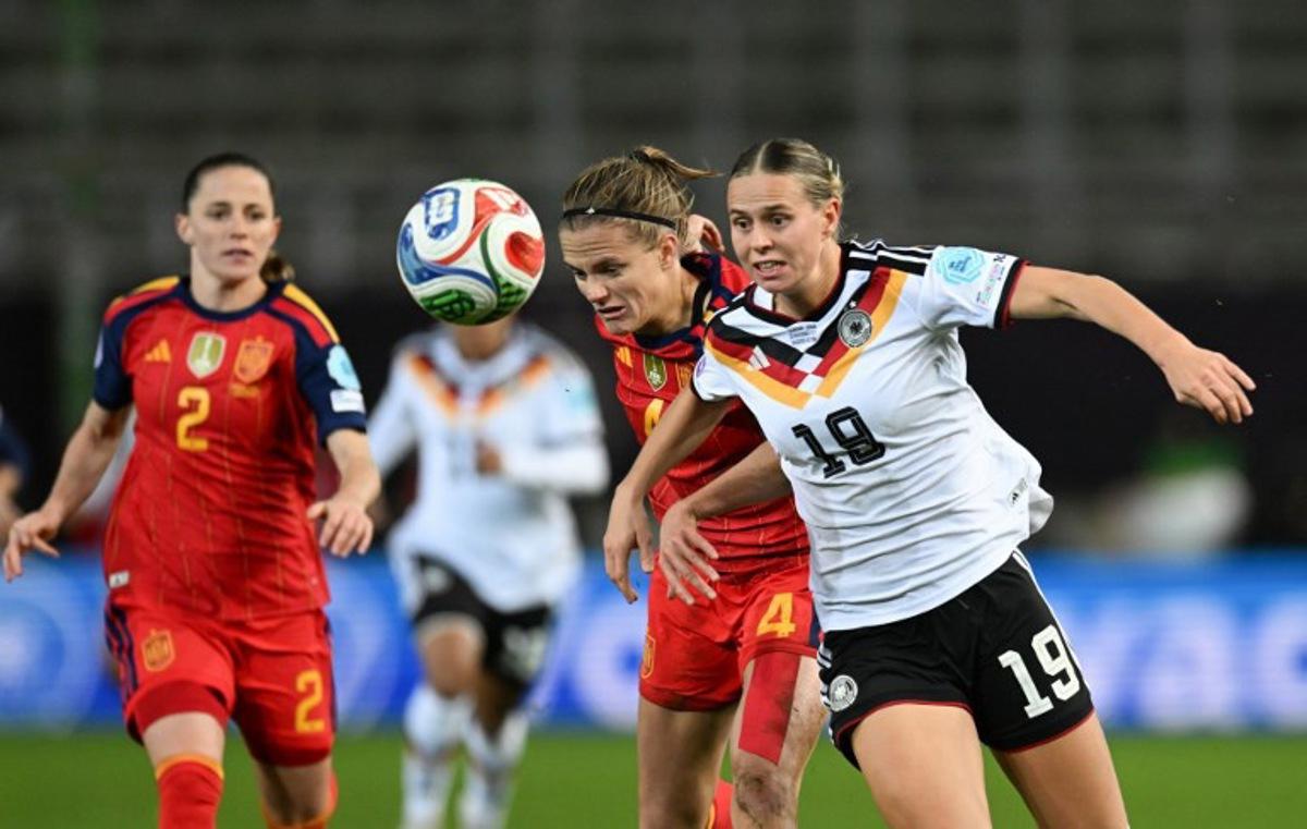 Germany's midfielder #19 Klara Buehl (R) and Spain's defender #04 Irene Paredes vie for the ball during UEFA Women's Nations League first leg final football match between Germany and Spain in Kaiserslautern, western Germany on November 28, 2025. THOMAS KIENZLE / AFP