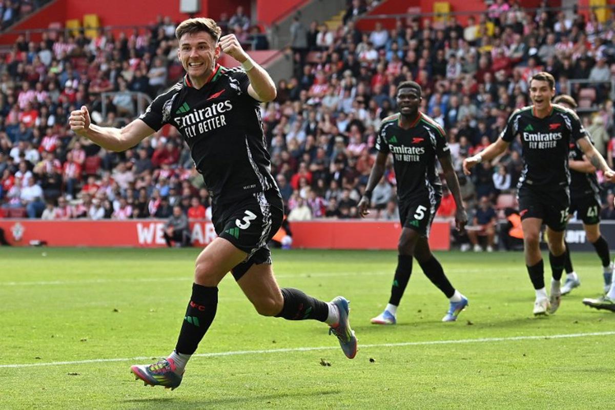 Arsenal's Scottish defender #03 Kieran Tierney celebrates after scoring a goal during the English Premier League football match between Southampton and Arsenal at St Mary's Stadium in Southampton, southern England on May 25, 2025. Glyn KIRK / AFP