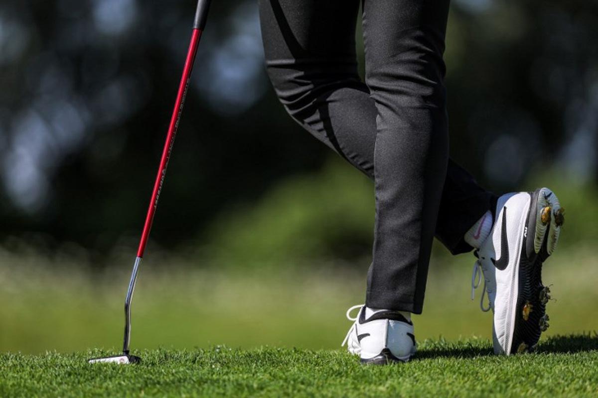 Thailand's Atthaya Thitikul stands during round 2 of the women's golf individual stroke play of the Paris 2024 Olympic Games at Le Golf National in Guyancourt, south-west of Paris on August 8, 2024. Pierre-Philippe MARCOU / AFP