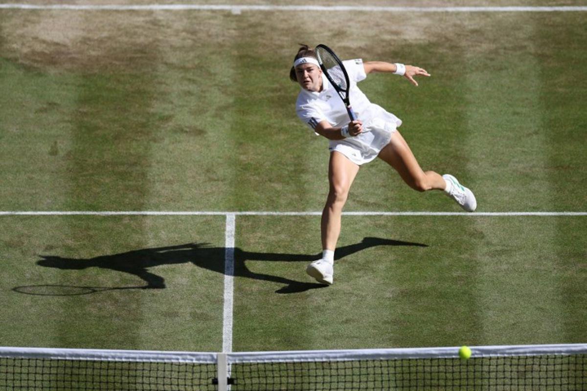 Czech Republic's Karolina Muchova returns against Japan's Naomi Osaka during their women's singles quarter-final tennis match on the ninth day of the 2026 Wimbledon Championships at The All England Lawn Tennis and Croquet Club in Wimbledon, southwest London, on July 7, 2026. Henry NICHOLLS / AFP