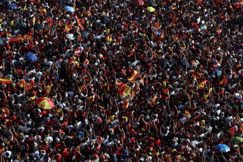 Spain fans pack Cibeles Square in Madrid on July 20, 2026, as they await the arrival of Spain's players one day after the national football team won their second World Cup title following a 1-0 victory against Argentina. Spain's World Cup winners come back home to a heroes' welcome in Madrid, where a million fans are expected to greet them after a night of raucous celebrations across the country. Pierre-Philippe MARCOU / AFP