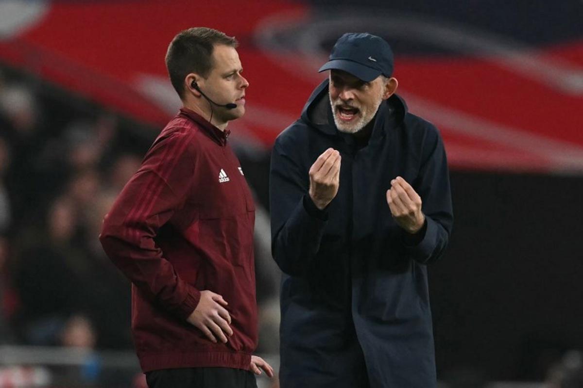 England's German head coach Thomas Tuchel (R) appeals to the Israeli fourth official Yigal Frid (L) during the 2026 World Cup Group K qualifier football match between England and Latvia, at Wembley stadium, in London, on March 24, 2025. Glyn KIRK / AFP