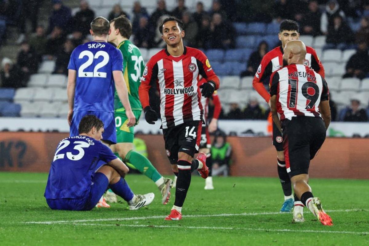 Brentford's Portuguese midfielder #14 Fabio Carvalho (C) celebrates after scoring his team fourth goal during the English Premier League football match between Leicester City and Brentford at King Power Stadium in Leicester, central England on February 21, 2025. Darren Staples / AFP