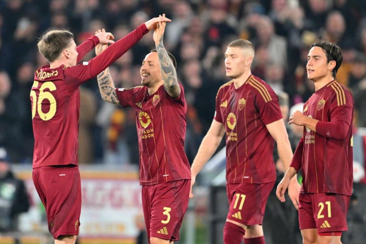 Roma's Spanish defender #03 Jose Tasende celebrates scoring his team's first goal with teammates Roma's Belgian forward #56 Alexis Saelemaekers, Roma's Ukrainian forward #11 Artem Dovbyk and Roma's Argentine forward #21 Paulo Dybala during the EUFA Europa League football match between AS Roma and Eintracht Frankfurt at the Olympic stadium in Rome, on January 30, 2025. Andreas SOLARO / AFP