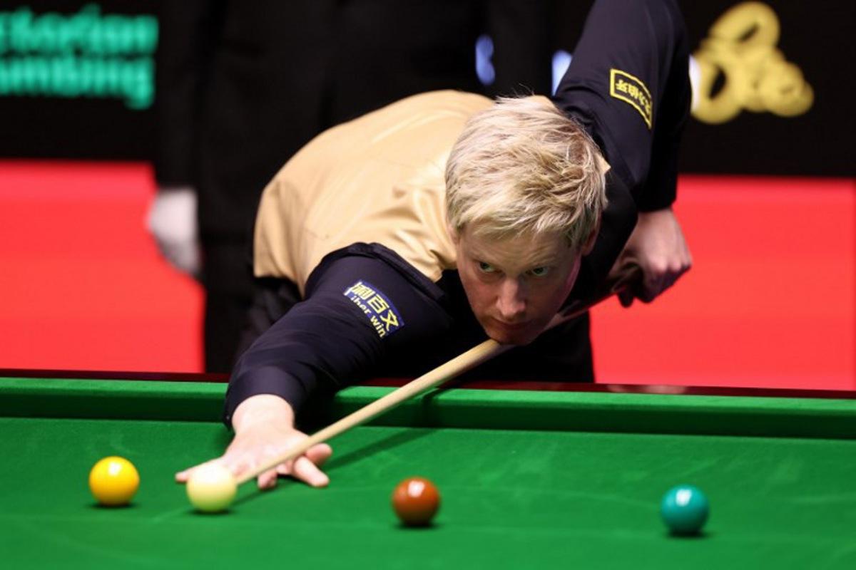 Australia's Neil Robertson plays a shot against China's Pang Junxu during the World Snooker Championship Round One match at The Crucible in Sheffield, northern England on April 22, 2026. The World Snooker Championship 2025 will take place from April 19 to May 5, 2025. Darren Staples / AFP