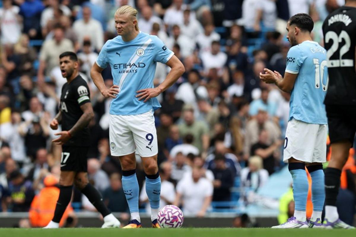 Manchester City's Norwegian striker #09 Erling Haaland reacts after the team conceded a second goal during the English Premier League football match between Manchester City and Tottenham Hotspur at the Etihad Stadium in Manchester, north west England, on August 23, 2025. Darren Staples / AFP