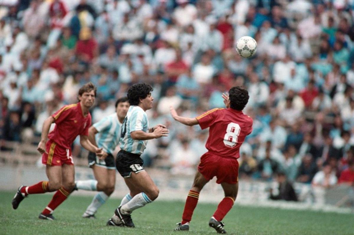 Argentina's Diego Maradona (C) fights for the ball against Belgium's Enzo Scifo (R) during the 1986 World cup football match between Argentina and Belgium on June 25, 1986 in Mexico city. The 1986 FIFA World Cup was the thirteenth edition of the tournament, which is held every four years. Held in Mexico from 31 May to 29 June, it was won by Argentina, led by the 25-year-old Diego Maradona, who was at the peak of his career. AFP