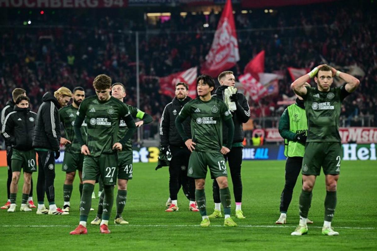 Celtic players reacts after the UEFA Champions League second-leg, knockout phase play-off match FC Bayern Munich vs Celtic on February 18, 2025 in Munich. Tobias SCHWARZ / AFP