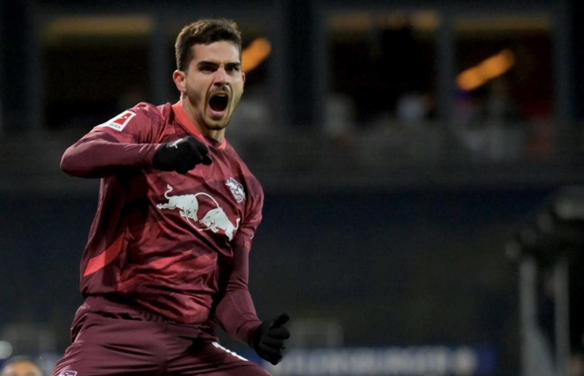 Leipzig's Portuguese forward #19 Andre Silva celebrates after scoring the 0-2 goal during the German first division Bundesliga football match between Holstein Kiel and RB Leipzig in Kiel, northern Germany, on December 7, 2024. FABIAN BIMMER / AFP