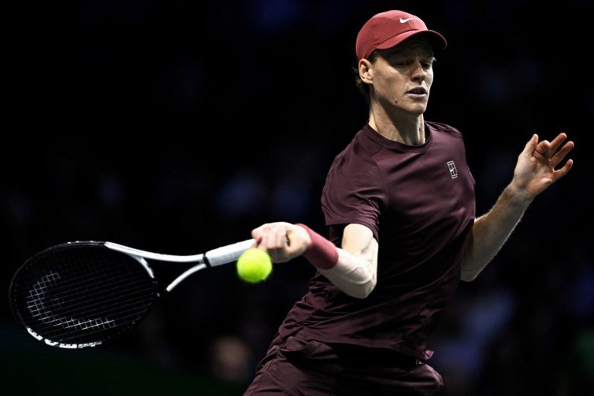 Italy's Jannik Sinner plays a forehand return to Germany's Alexander Zverev during their men's singles semi-final match on day six of the Paris ATP Masters 1000 tennis tournament at the Paris La Défense Arena in Nanterre, on the outskirts of Paris, on November 1, 2025. JULIEN DE ROSA / AFP