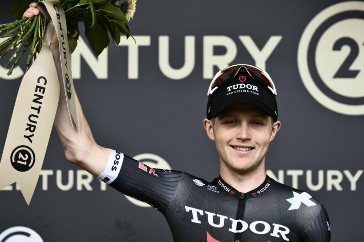 Tudor Pro Cycling Team's Australian rider Michael Storer celebrates on the podium with the most combative rider's award after the 15th stage of the 112th edition of the Tour de France cycling race, 169.3 km between Muret and Carcassonne, southwestern France, on July 20, 2025. Marco BERTORELLO / AFP