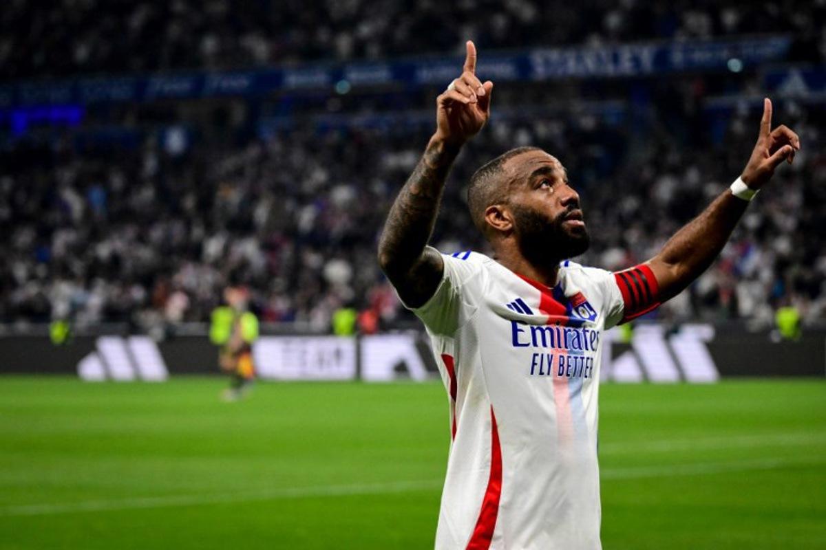 Lyon's French forward #10 Alexandre Lacazette celebrates after scoring a goal during the French L1 football match between Olympique Lyonnais (OL) and LOSC (Lille) at the Parc Olympique Lyonnais Groupama stadium in Decines-Charpieu, central-eastern France on April 5, 2025. OLIVIER CHASSIGNOLE / AFP