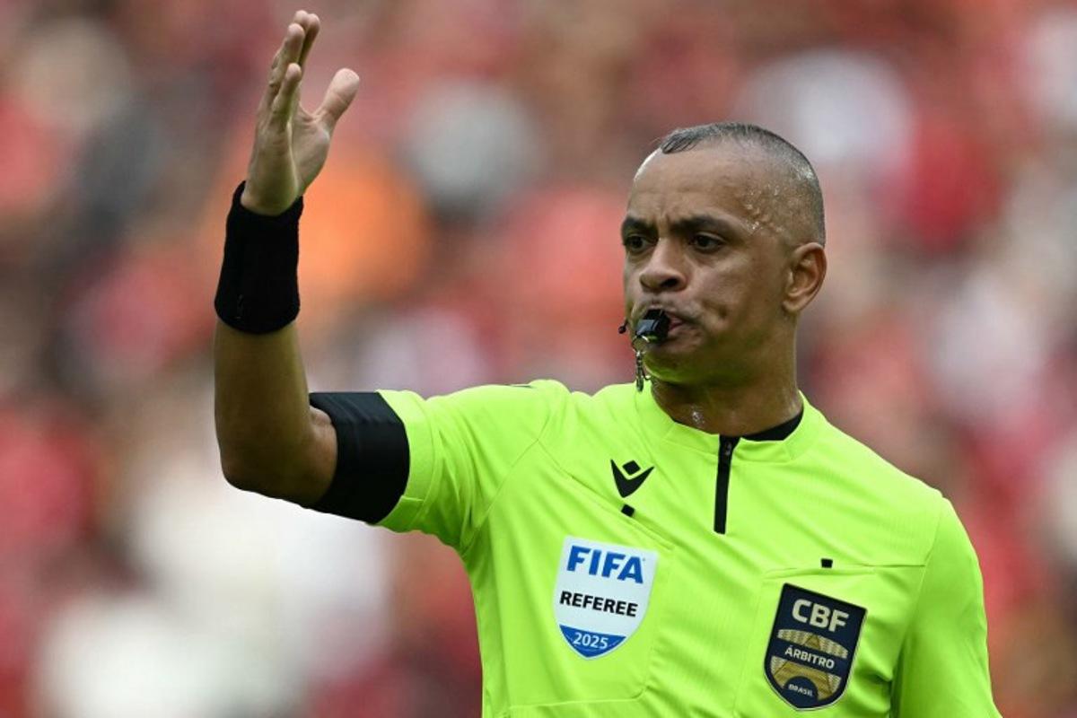 Brazilian referee Wilton Pereira Sampaio reacts during the Brasileirao Serie A football match between Flamengo and Palmeiras at Maracana Stadium in Rio de Janeiro, Brazil on October 19, 2025. Mauro PIMENTEL / AFP