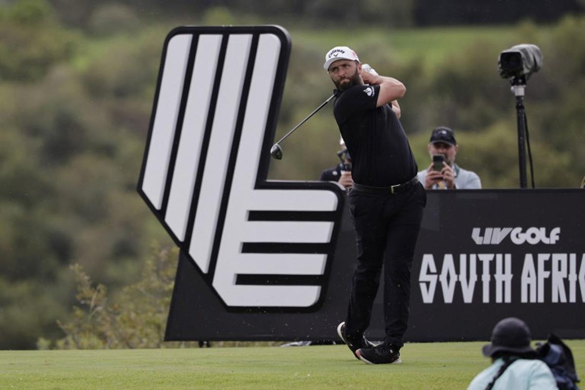 Legion XIII's Spanish player Jon Rahm watches a drive from the 14th tee on the fourth day of the LIV Golf South Africa tournament at The Club in Steyn City on March 22, 2026. WIKUS DE WET / AFP