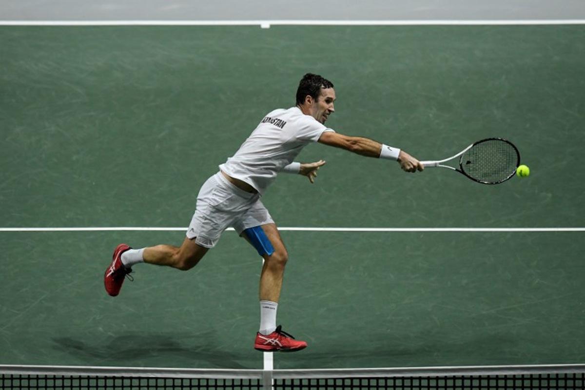 Kazakhstan's Mikhail Kukushkin returns the ball to Serbia's Miomir Kecmanovic during the men's singles quarter-final tennis match between Serbia and Kazakhstan of the Davis Cup tennis tournament at the Madrid arena in Madrid on December 1, 2021. OSCAR DEL POZO / AFP
