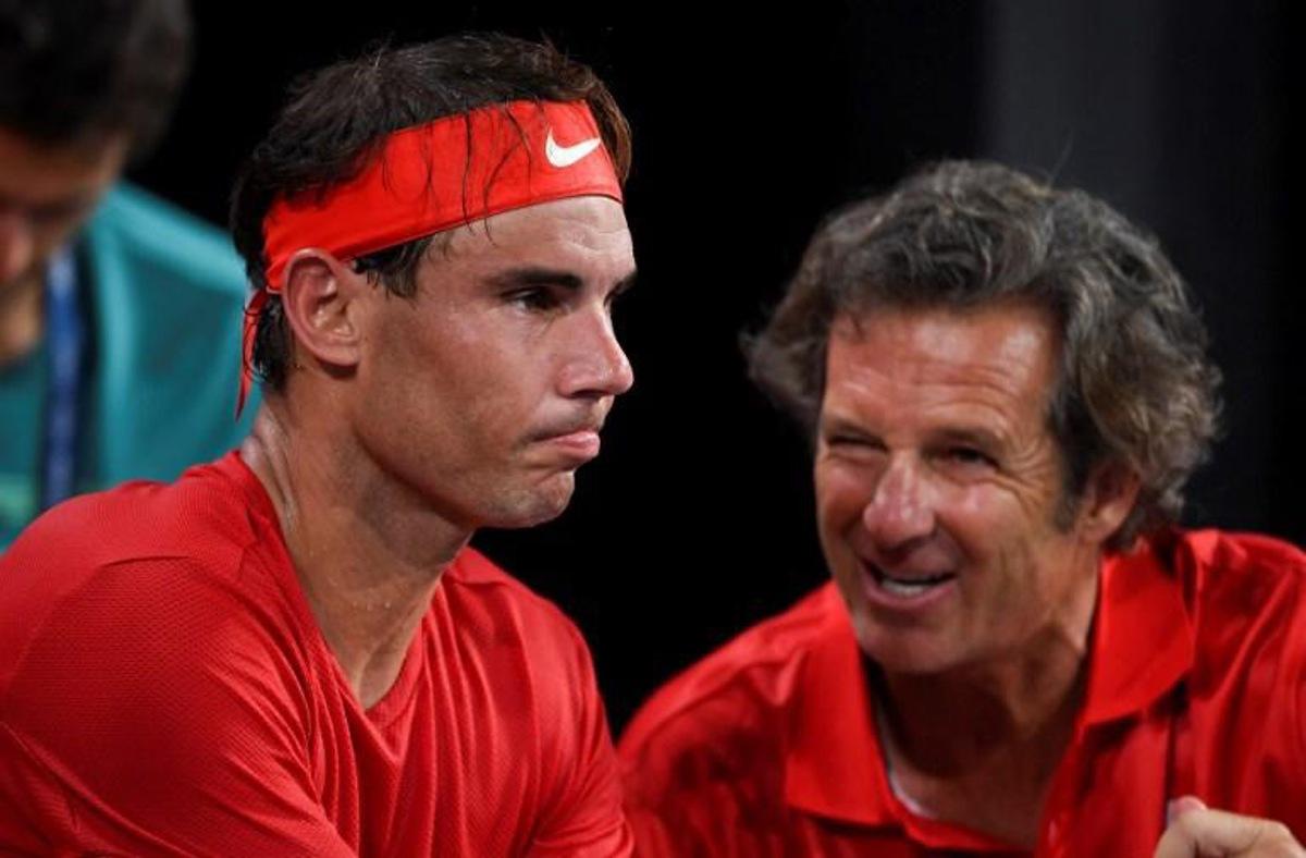 Rafael Nadal of Spain (L) listens to coach Francisco Roig in his men's singles match against David Goffin of Belgium at the ATP Cup tennis tournament in Sydney on January 10, 2020. William WEST / AFP --IMAGE RESTRICTED TO EDITORIAL USE - NO COMMERCIAL USE--