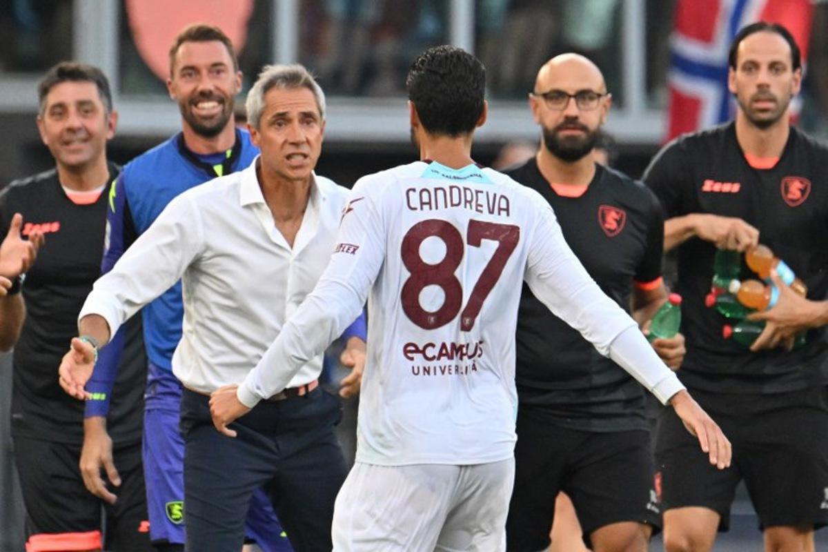 Salernitana's Italian midfielder #87 Antonio Candreva celebrates with Salernitana's Portuguese coach Paulo Sousa after scoring during the Italian Serie A football match Roma vs Salernitana on August 20, 2023 at the Olympic stadium in Rome. Alberto PIZZOLI / AFP
