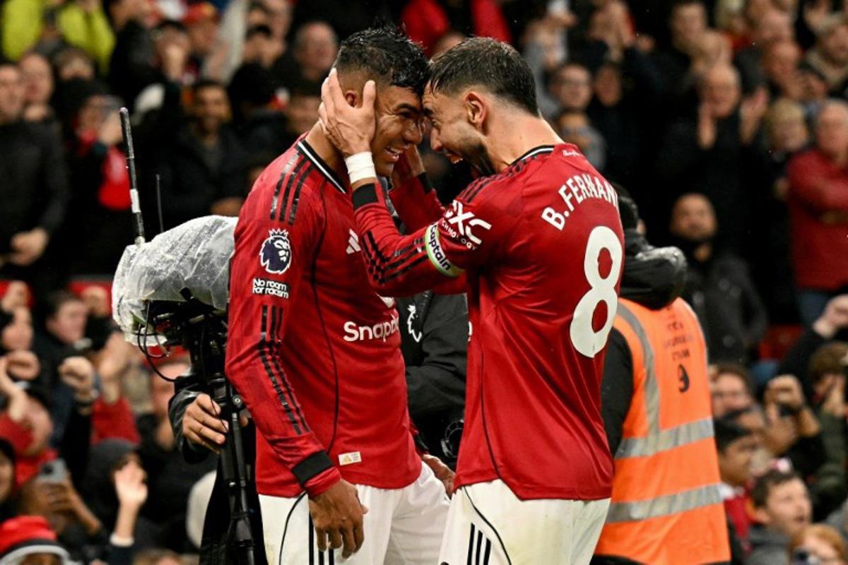 Manchester United's Brazilian midfielder #18 Casemiro celebrates scoring the team's second goal during the English Premier League football match between Manchester United and Chelsea at Old Trafford in Manchester, north west England, on September 20, 2025. Oli SCARFF / AFP