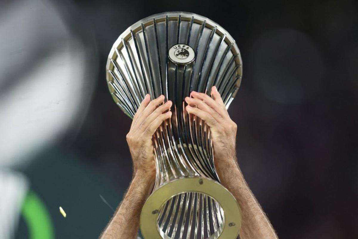 The trophy is lifted after the end of the UEFA Conference League final football match between Crystal Palace FC and Rayo Vallecano de Madrid in Leipzig, eastern Germany, on May 27, 2026. Ronny HARTMANN / AFP
