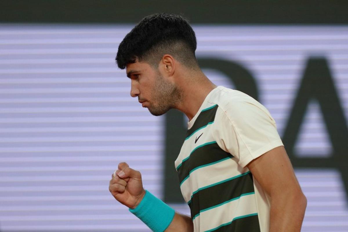Spain's Carlos Alcaraz reacts to a point against US Tommy Paul during their quarter-final men's singles match on day 10 of the French Open tennis tournament on Court Philippe-Chatrier at the Roland-Garros Complex in Paris on June 3, 2025. Dimitar DILKOFF / AFP