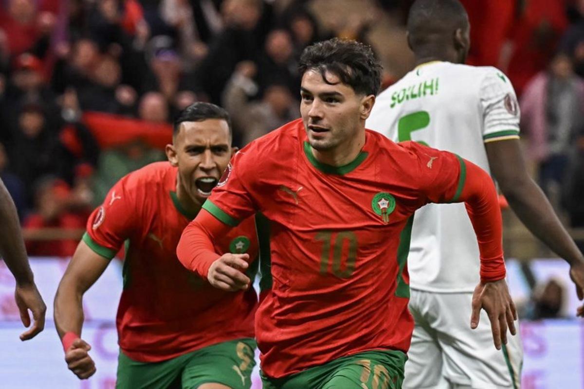 Morocco's forward #10 Brahim Diaz celebrates his goal during the Africa Cup of Nations (CAN) group A football match between Morocco and Comoros at Prince Moulay Abdellah Stadium in Rabat on December 21, 2025. Paul ELLIS / AFP