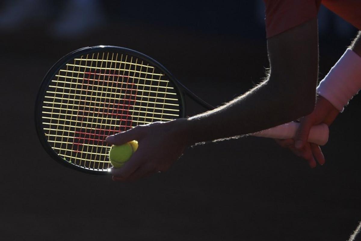 Greece's Stefanos Tsitsipas holds the ball as he prepares to serve to Argentina's Facundo Diaz Acosta during the ATP Barcelona Open "Conde de Godo" tennis tournament singles match at the Real Club de Tenis in Barcelona, on April 19, 2024. Josep LAGO / AFP