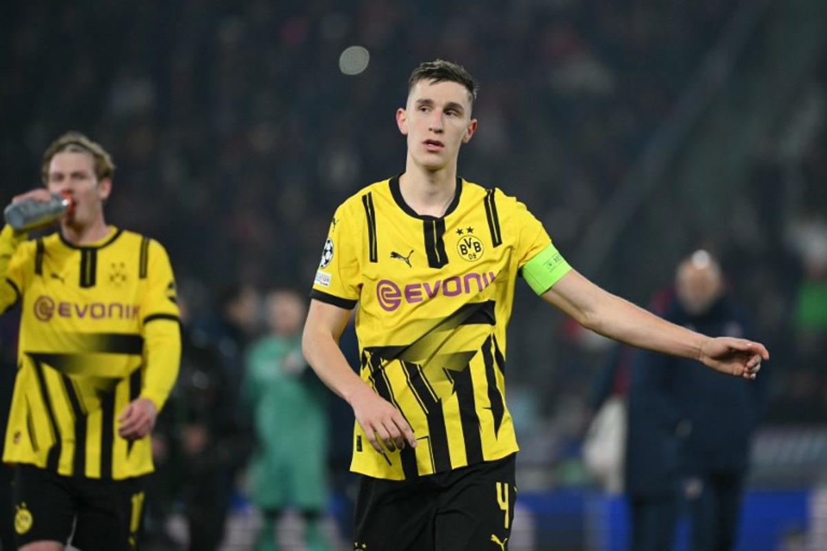 Dortmund's German defender #04 Nico Schlotterbeck looks dejected after being defeated in the UEFA Champions League football match between Bologna and Borussia Dortmund at the Renato Dall'Ara stadium in Bologna on January 21, 2025. Alberto PIZZOLI / AFP