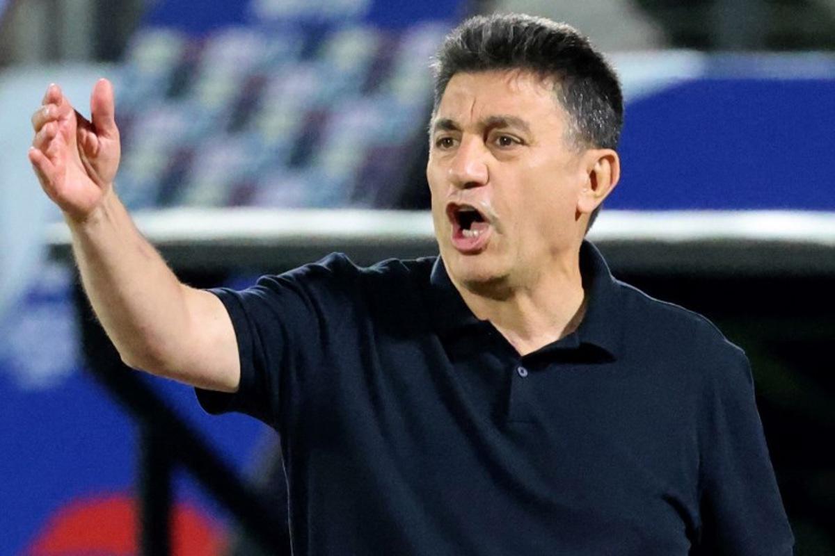 Iran's coach Amir Ghalenoei speaks to his players during the FIFA World Cup 2026 Asia zone qualifiers group A football match between Iran and the North Korea at the Azadi Sports Complex in Tehran on June 10, 2025. ATTA KENARE / AFP