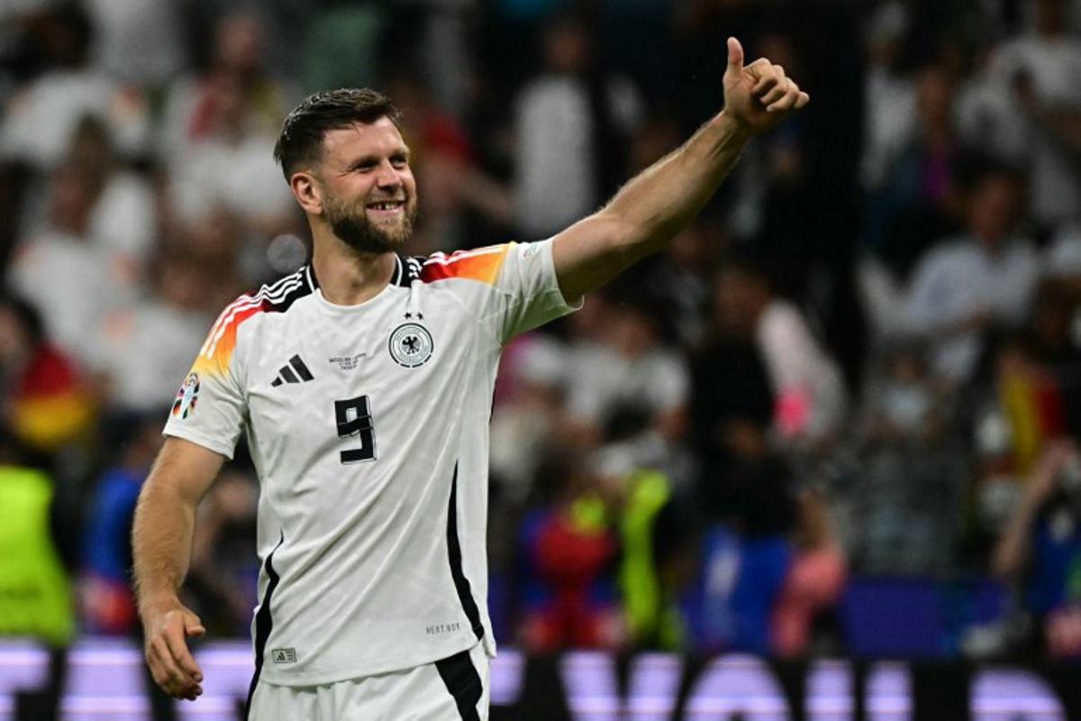 Germany's forward #09 Niclas Fullkrug celebrates after the UEFA Euro 2024 Group A football match between Switzerland and Germany at the Frankfurt Arena in Frankfurt am Main on June 23, 2024. Tobias SCHWARZ / AFP