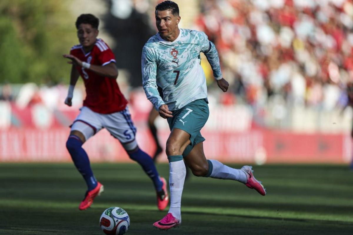Portugal's forward #07 Cristiano Ronaldo dribbles the ball during the international friendly football match between Portugal and Chile at Estadio Nacional do Jamor in Oeiras, on June 6, 2026. PATRICIA DE MELO MOREIRA / AFP