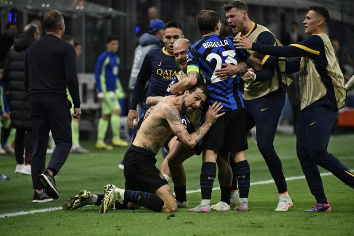 Inter Milan's Italian defender #15 Francesco Acerbi celebrates scoring his team's third goal with teammates during the UEFA Champions League semi-final second leg football match between Inter Milan and FC Barcelona at the San Siro stadium in Milan on May 6, 2025. PIERO CRUCIATTI / AFP