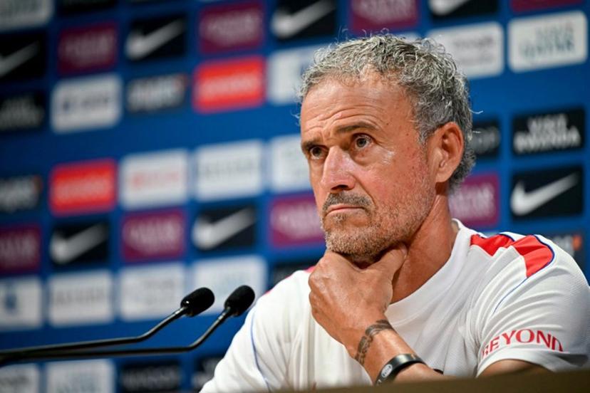 PSG's Spanish headcoach Luis Enrique looks on as he delivers a press conference following a training session at the Paris Saint-Germain's campus in Poissy, west of Paris on August 15, 2026, on the eve of their French Super Cup (Trophee des Champions) football match against RC Lens. LOU BENOIST / AFP