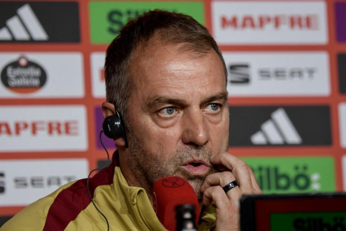 Barcelona's German coach Hans-Dieter Flick looks on during a press conference at La Cartuja stadium on the eve of their Spanish Cup (King's Cup) final between FC Barcelona and Real Madrid CF in Seville, on April 25, 2025. CRISTINA QUICLER / AFP