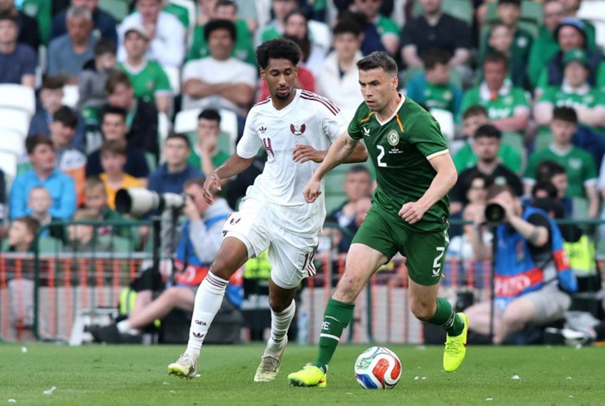Republic of Ireland's defender Seamus Coleman is put under pressure by Qatar's Defender #04 Issa Laye during the international friendly football match between the Republic of Ireland and Qatar, at the Aviva Stadium in Dublin, Ireland on May 28, 2026. Paul Faith / AFP