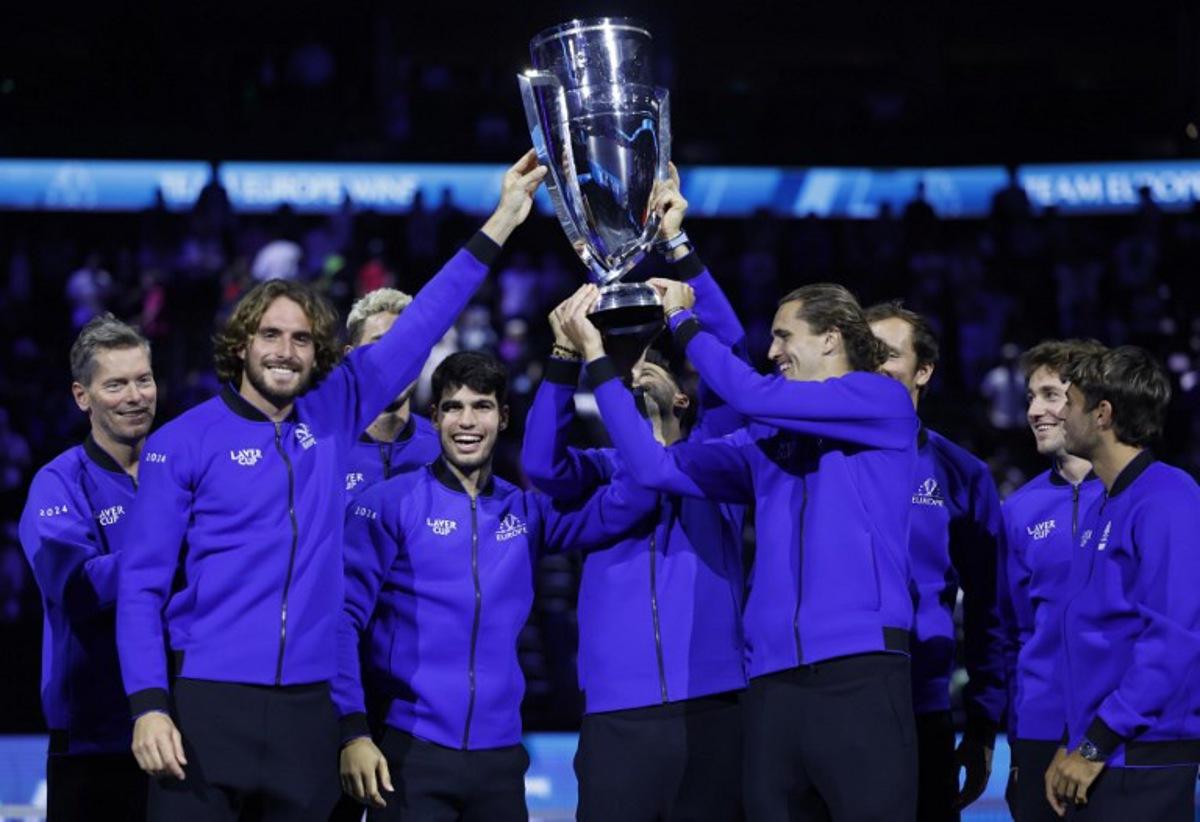 Greece's Stefanos Tsitsipas (2L), Spain's Carlos Alcaraz (3L), Germany's Alexander Zverev (4R) and other players of Team Europe celebrate with the trophy during the awarding ceremony at the end of the 2024 Laver Cup tennis tournament in Berlin, Germany on September 22, 2024. Spain's Carlos Alcaraz won the last match of the tournament 6-2, 7-5 against USA's Taylor Fritz of Team World. Team Europe won 13-11 against Team World. Odd ANDERSEN / AFP