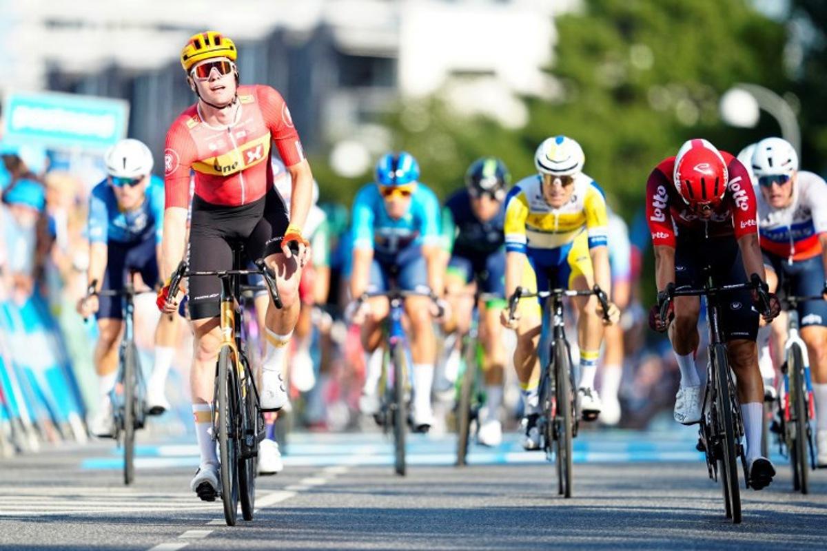 Norway's Soren Waerenskjold (L) rides to win the second stage of the PostNord cycling Tour of Denmark (Danmark Rundt) in Gladsaxe, Denmark, on August 13, 2025. Mads Claus Rasmussen / Ritzau Scanpix / AFP