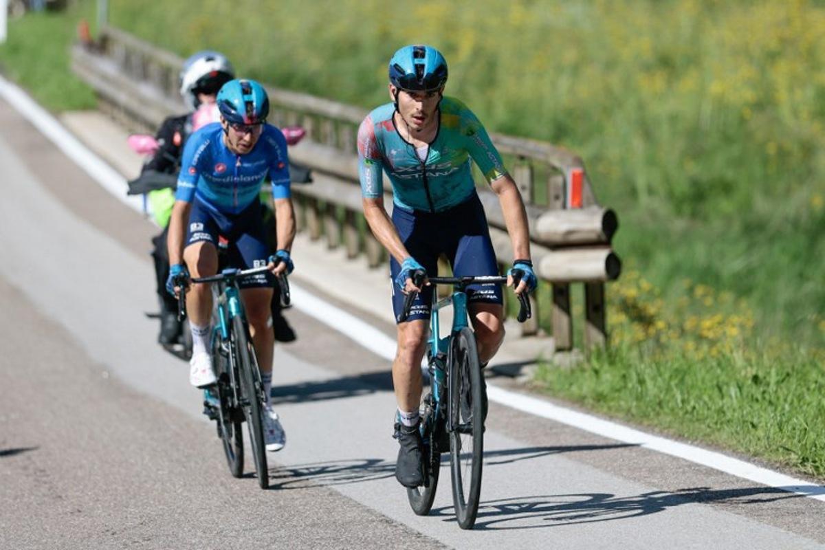 XDS Astana Team's Italian rider Christian Scaroni (R) rides ahead XDS Astana Team's Italian rider Lorenzo Fortunato in the ascent of San Valentino during the 16th stage of the 108th Giro d'Italia cycling race of 203kms from Piazzola sul Brenta to San Valentino on May 27, 2025. Luca Bettini / AFP