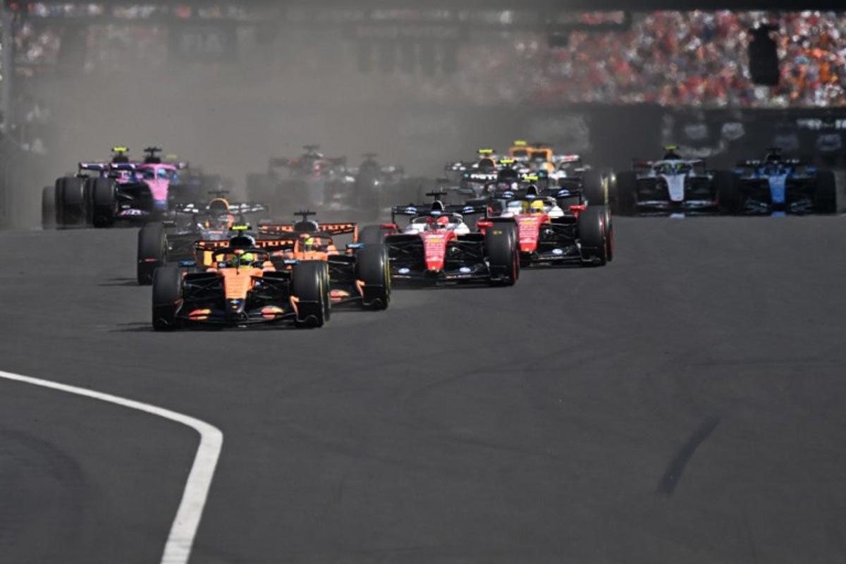 McLaren's British driver Lando Norris (C) followed by McLaren's Australian driver Oscar Piastri (C-R) and other cars compete during the Formula One Hungarian Grand Prix at the Hungaroring racetrack in Mogyorod near Budapest, Hungary, on July 26, 2026. Attila KISBENEDEK / AFP