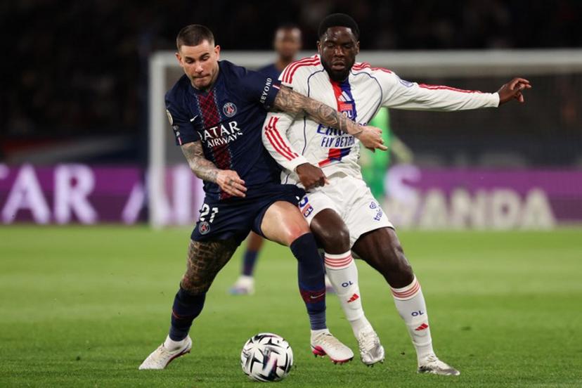 Paris Saint-Germain's French defender #21 Lucas Hernandez (L) fights for the ball with Lyon's Belgian midfielder #05 Orel Mangala during the French L1 football match between Paris Saint-Germain (PSG) and Olympique Lyonnais (OL) at the Parc des Princes stadium in Paris on April 19, 2026. FRANCK FIFE / AFP