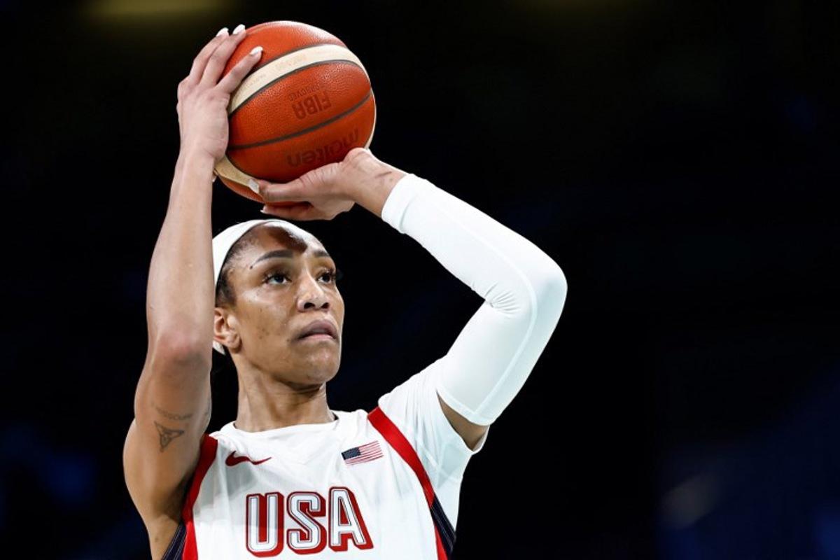 USA's #09 A'ja Wilson takes a free throw in the women's preliminary round group C basketball match between USA and Japan during the Paris 2024 Olympic Games at the Pierre-Mauroy stadium in Villeneuve-d'Ascq, northern France, on July 29, 2024. Sameer Al-Doumy / AFP