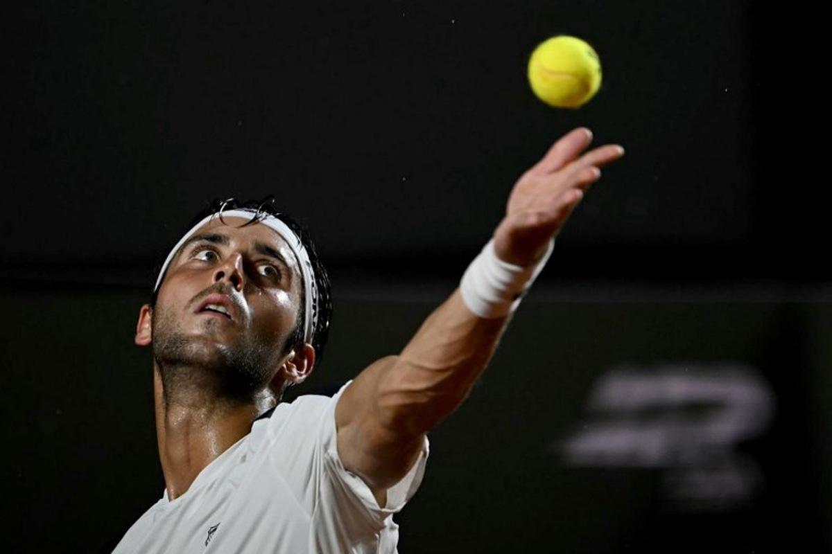 Argentina's Tomas Etcheverry serves against Chile's Alejandro Tabilo during their men's singles final match at the Rio Open tennis tournament in Rio de Janeiro, Brazil, on February 22, 2026. Mauro PIMENTEL / AFP