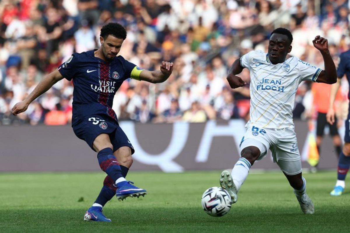 Paris Saint-Germain's French midfielder #33 Warren Zaïre-Emery (L) scores his side's second goal during the French L1 football match between Paris Saint-Germain (PSG) and FC Lorient at Parc des Princes stadium in Paris on May 2, 2026. FRANCK FIFE / AFP