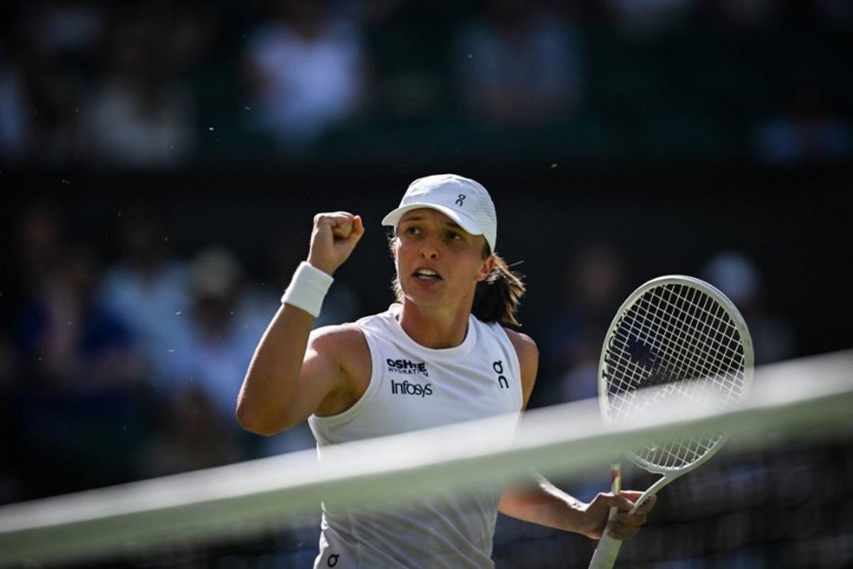 Poland's Iga Swiatek reacts after a point against Switzerland's Belinda Bencic during their women's singles semi-final tennis match on the eleventh day of the 2025 Wimbledon Championships at The All England Lawn Tennis and Croquet Club in Wimbledon, southwest London, on July 10, 2025. Kirill KUDRYAVTSEV / AFP